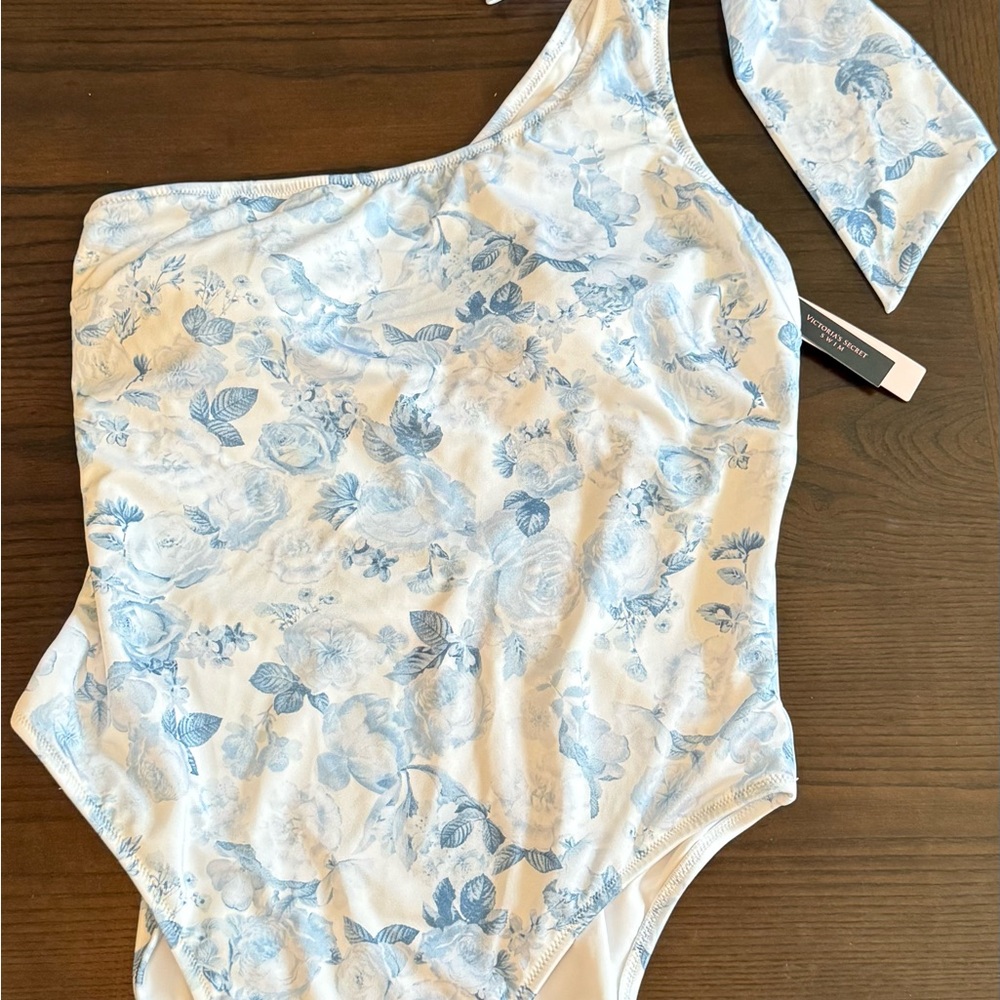 NWT Victoria's Secret Blue & White. 
One Shoulder. 
One piece Swimsuit. 
Size XL